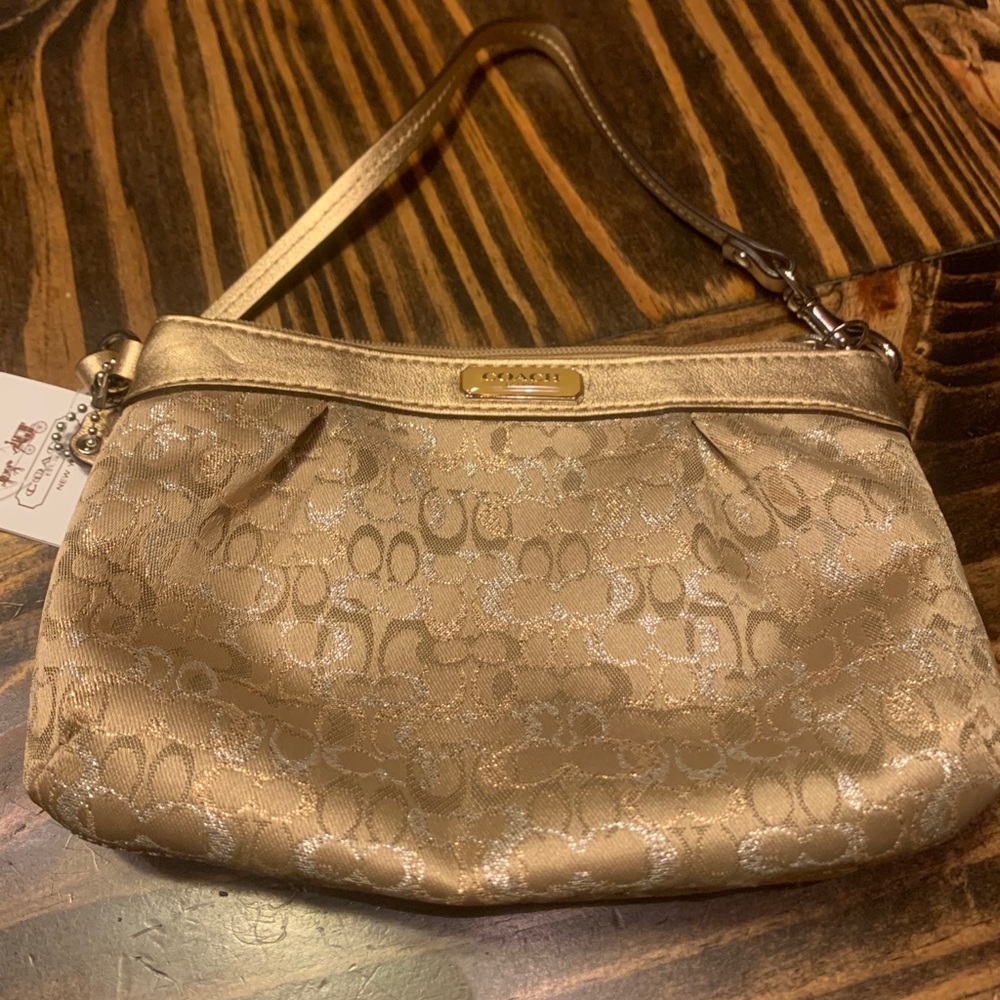 Gold coach wristlet